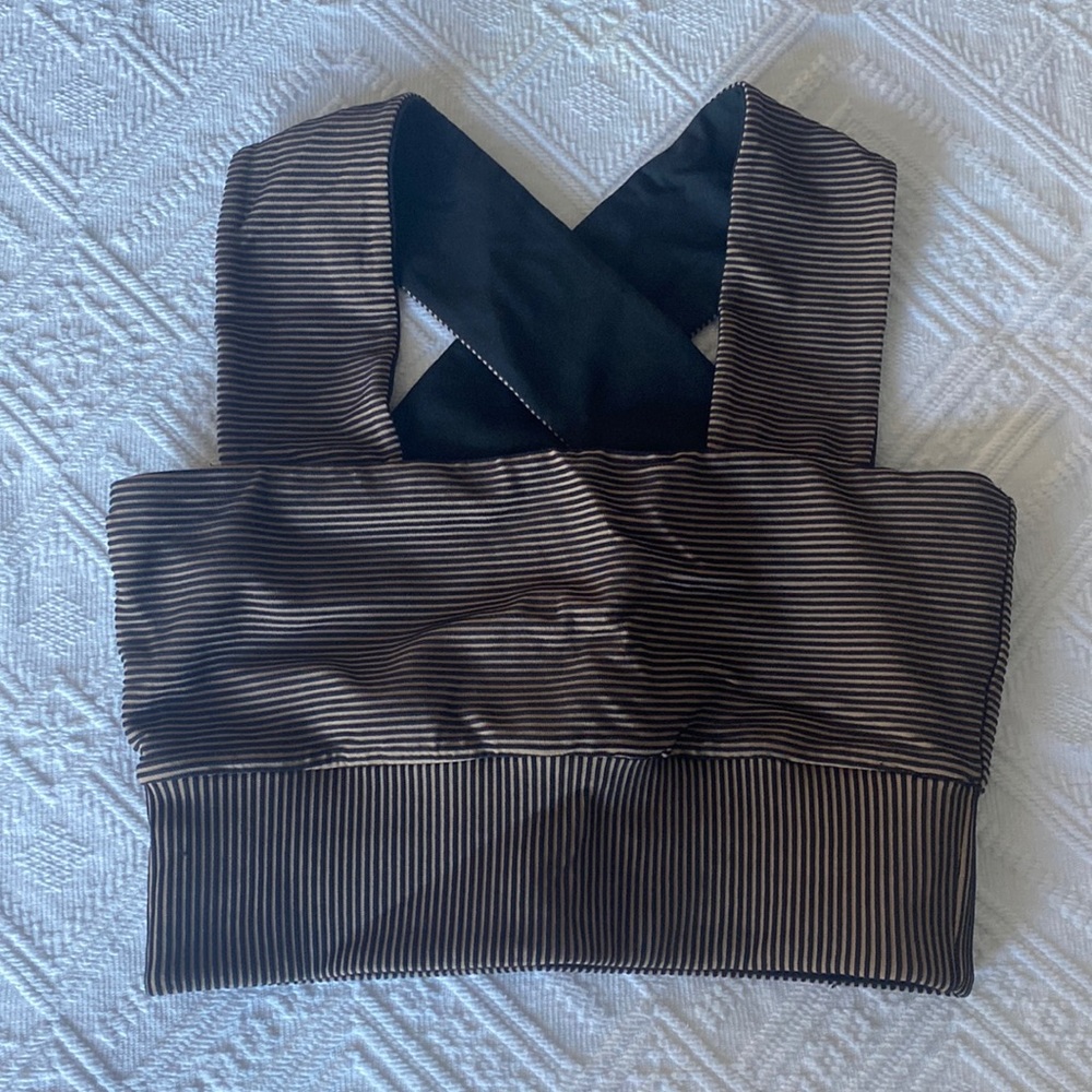 Sports bra top with black & tan stripes. Size small but runs smaller like XS